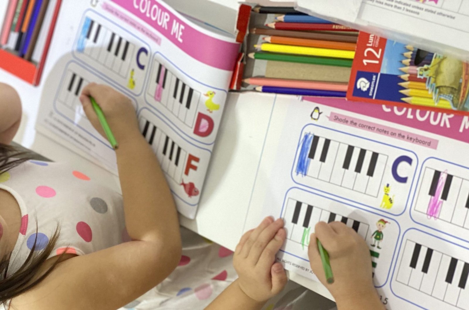 Why should piano lessons include written theory?